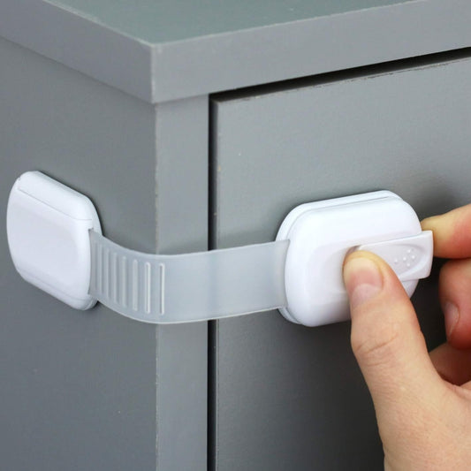 Slide-adjustable drawer safety lock with white latch, hand pressing to engage