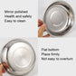 Stainless steel dinner plate close-up: smooth rim and flat base
