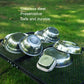 Stainless steel dinner plates on outdoor grilling mat