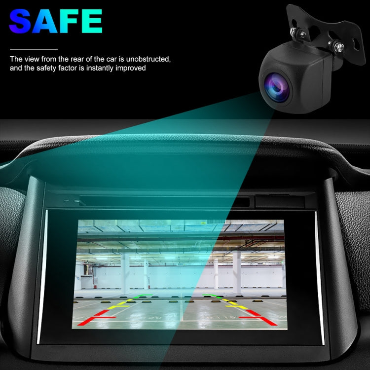 Black rearview camera mounted above car dashboard screen with parking guide lines