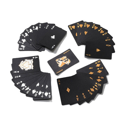 Spread of black playing cards with gold suit pips and court card artwork, waterproof finish