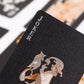 Close-up of black playing card corner with gold JOKER text and court illustration