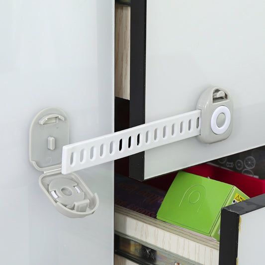 Drawer safety lock kit, white plastic with oval latch, installed on cabinet drawer