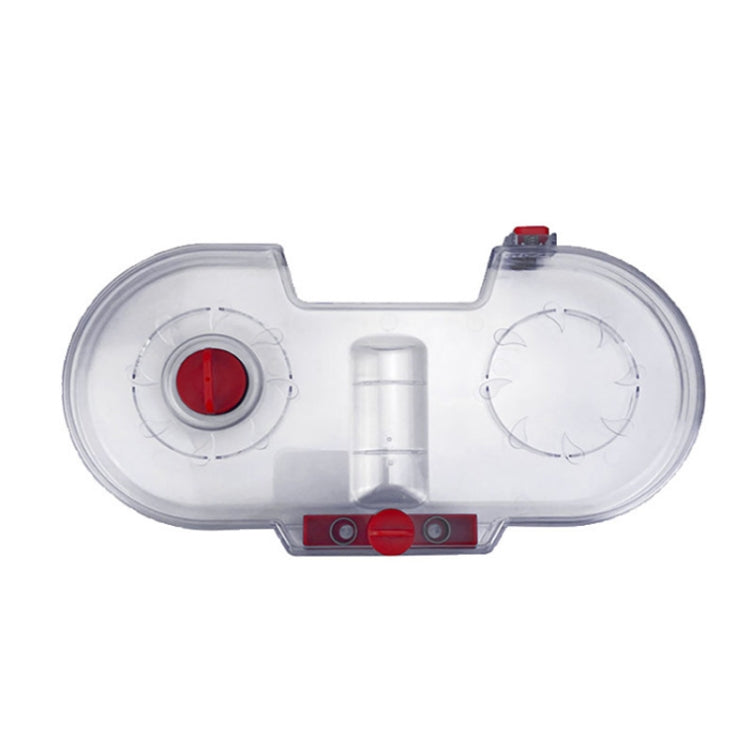 Transparent water tank housing with red control knob and circular valve ports