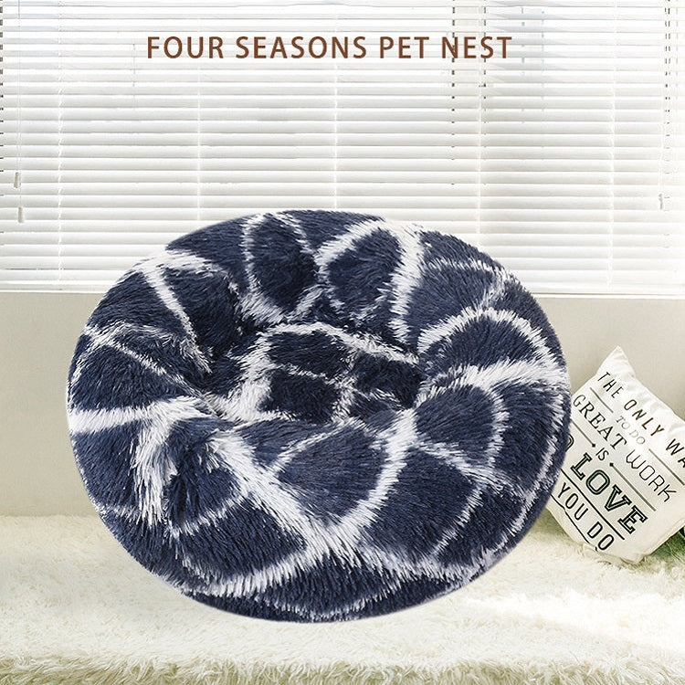 Round dark blue shag pet bed with white abstract swirl pattern