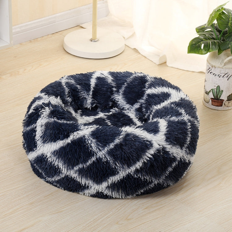 Dark blue round shag pet bed with long fur and white abstract pattern