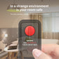 Black infrared detector with red sensor glow, held toward a surface with a finger.