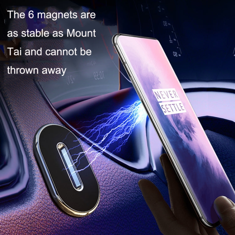 Black oval magnetic phone holder keeping a smartphone secured on car dashboard