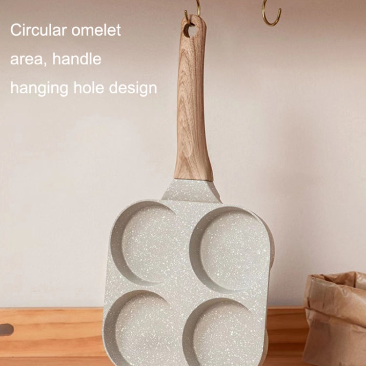 Four-hole omelet pan with hanging hole and wooden handle; speckled nonstick wells