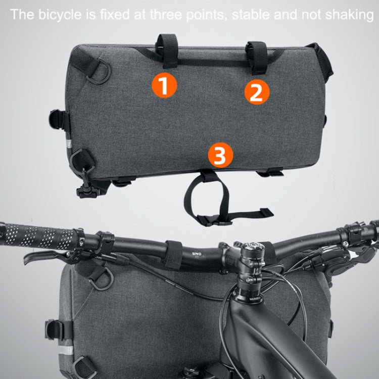Gray bike handlebar bag secured with multiple straps on a bicycle handlebar.
