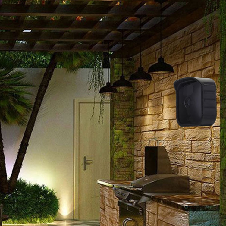 Black silicone protective cover on security camera mounted on wall