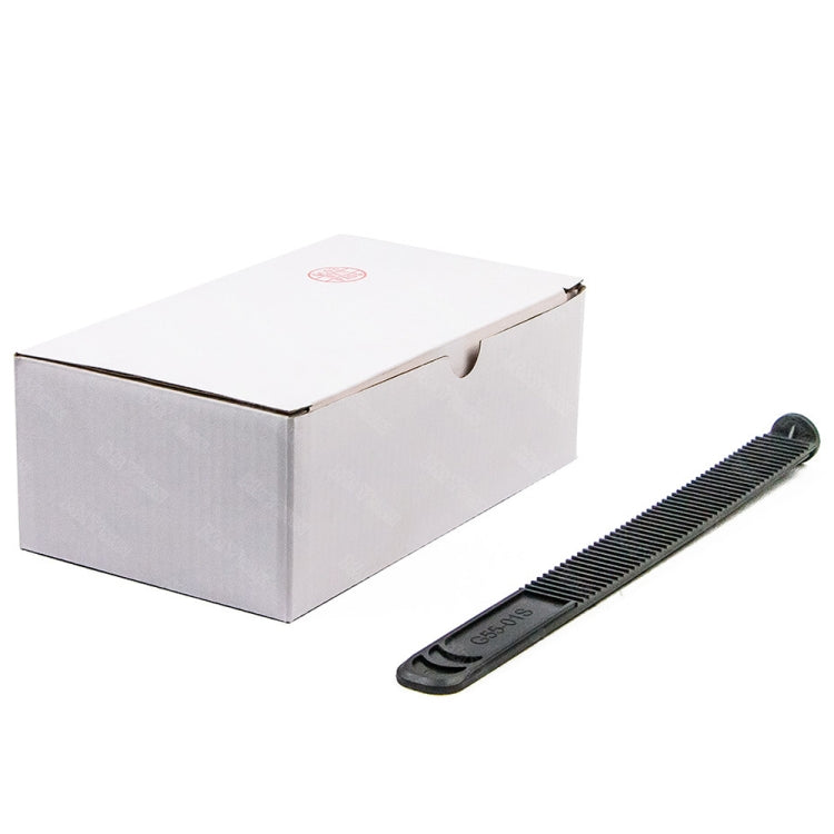 Manual glue pusher tool with black ridged comb and white packaging box