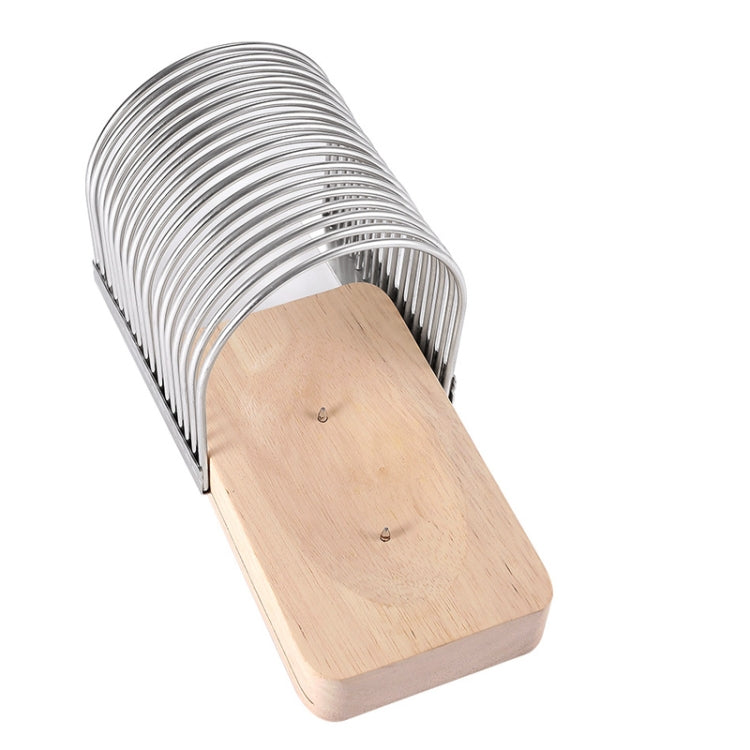 Arched metal toast slicer with wooden base and slotted cutting bars