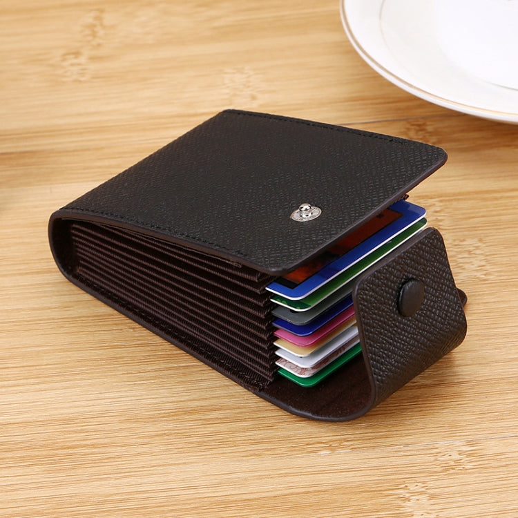 Vertical card holder with snap-flap closure, cards partially visible
