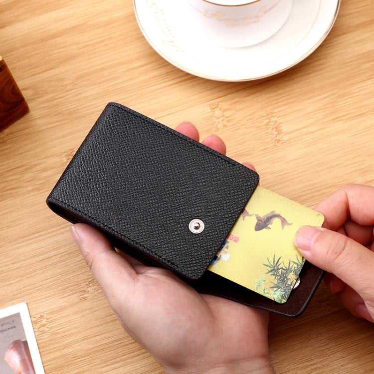 Black card holder with snap-flap closure, cards inserted