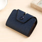Textured blue card holder with snap-flap closure, side profile