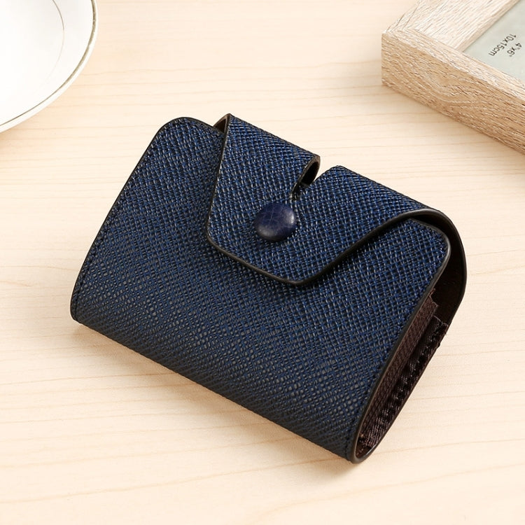 Textured blue card holder with snap-flap closure, side profile