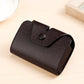 Textured coffee-brown card holder with snap-flap closure, angled view