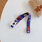 Kids beverage bottle lanyard strap, purple with rocket and cartoon tech print