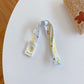 Kids beverage bottle lanyard strap, light with green and yellow icon pattern
