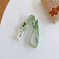 Kids beverage bottle lanyard strap, light green and white with tiny animal print