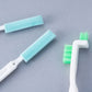 Three small cleaning brushes with light-blue foam pads and green bristle brush head