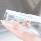 Three crevice cleaning brushes stored in a clear plastic case with foam and bristle heads