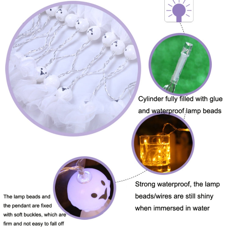Cloth ghost string lights with glowing white ghost faces on wire strand