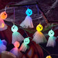 LED ghost string lights with blue, green, and orange glowing ghost faces and tulle skirts