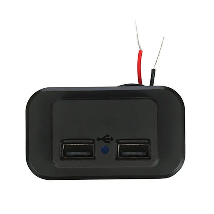 Black dual USB car charger with dust cover open, showing two USB ports and wires