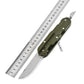 Olive folding knife-fork-spoon multi-tool shown with ruler for size