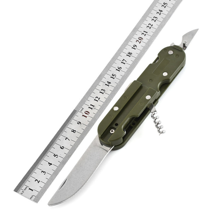 Olive folding knife-fork-spoon multi-tool shown with ruler for size