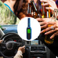 Blue breath alcohol tester with green digital display shown against drinks and car interior