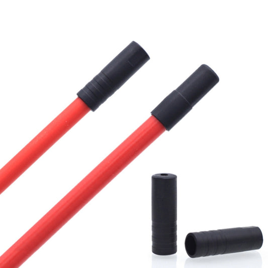 Pair of black plastic cable caps on red cable housings for bike brake/shift lines
