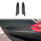 Carbon-fiber style inner armrest panel stickers applied on car door area, black