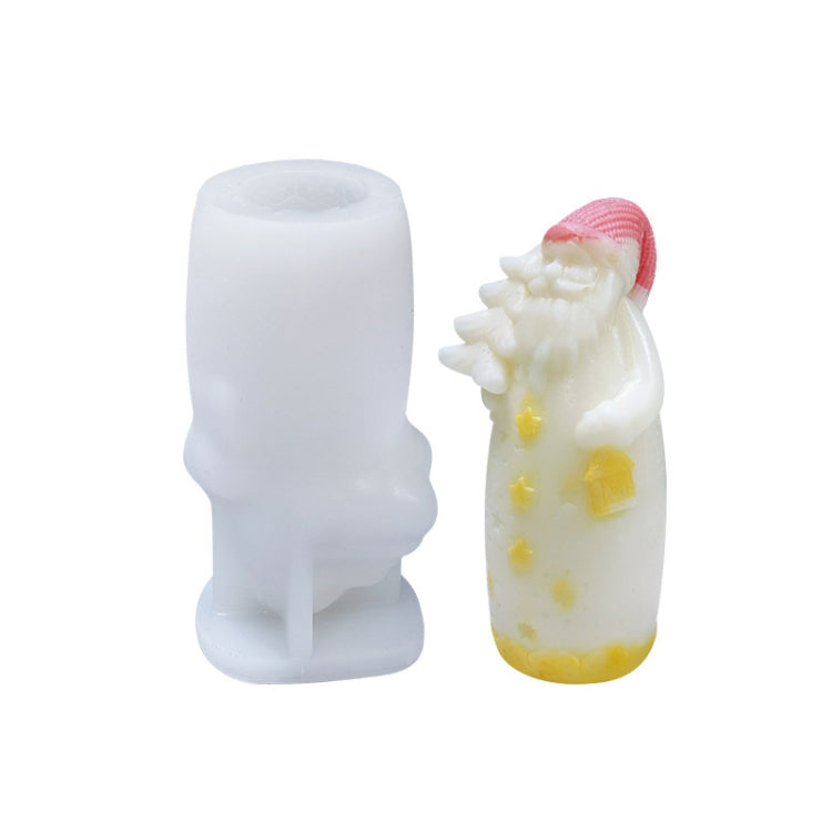 White silicone candle mold with tree-shaped candle; yellow and cream wax details visible.