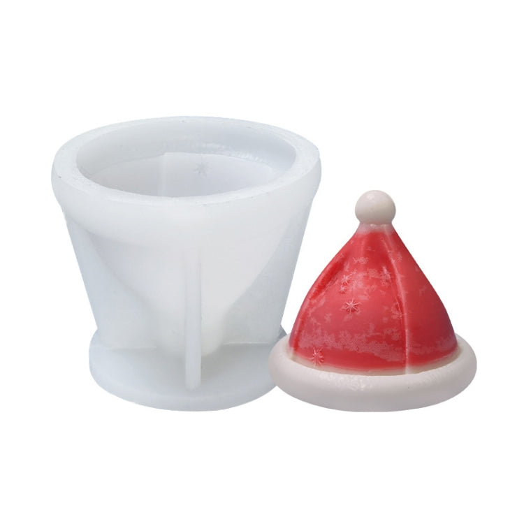 White silicone candle mold with red cone-shaped candle and white rim.