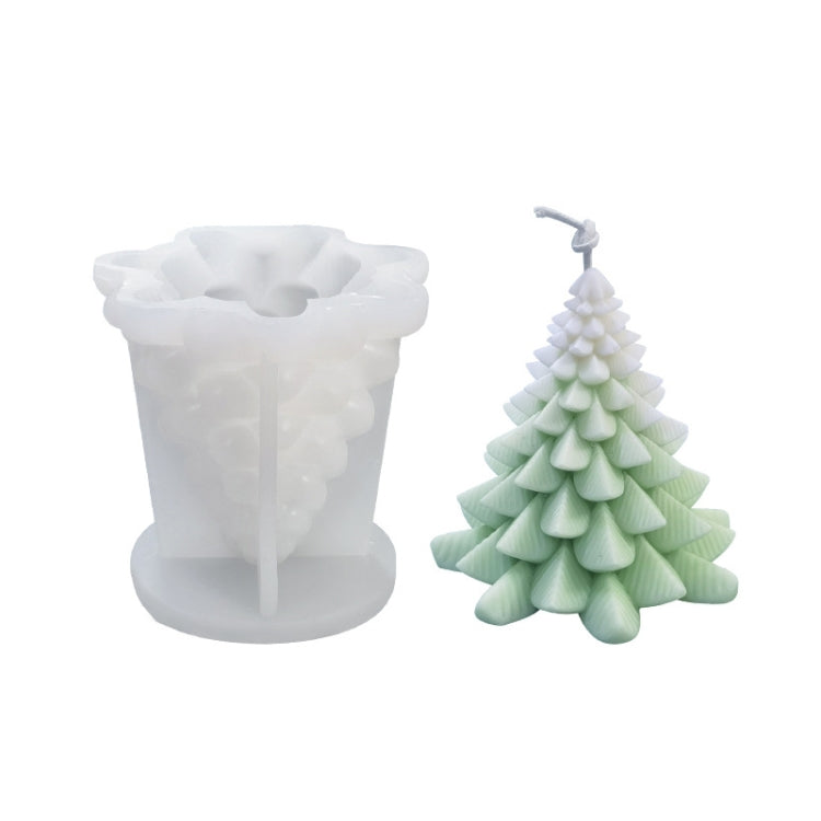 White silicone candle mold with white and green Christmas tree candle; tiered branches visible.