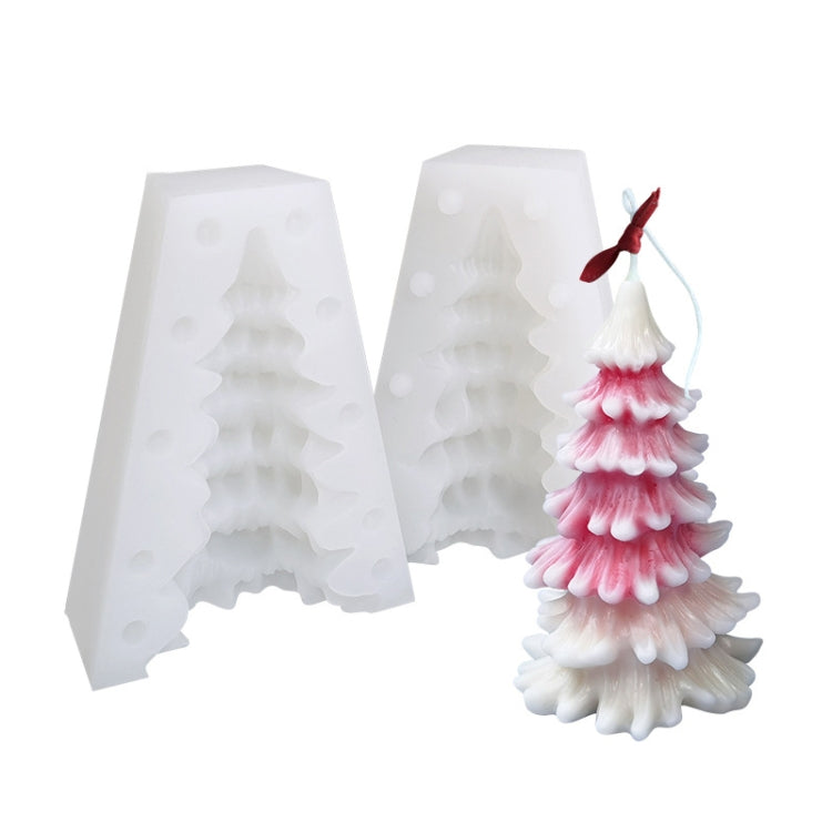 White two-piece Christmas tree silicone candle mold with sample pink-and-white layered candle