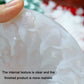Close-up of clear silicone candle mold surface with raised embossed details