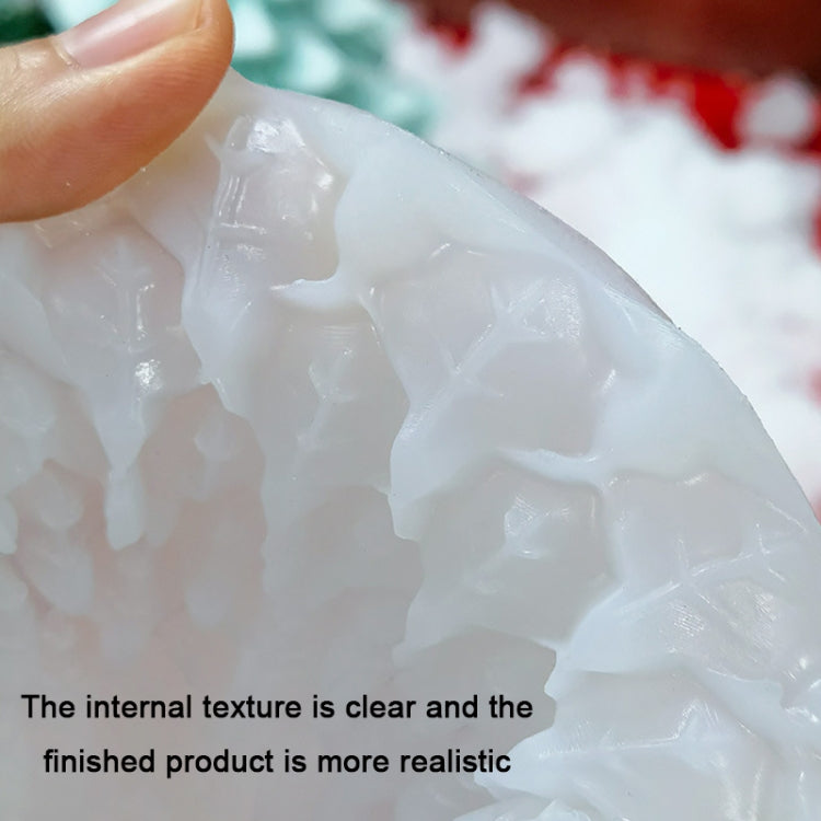 Close-up of clear silicone candle mold surface with raised embossed details