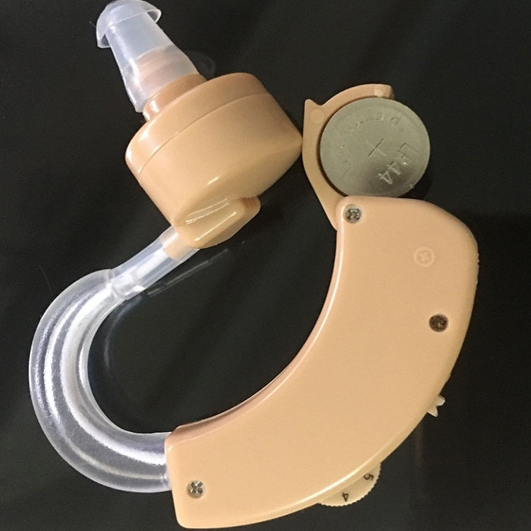 Tan behind-the-ear hearing aid with clear tubing and circular control panel