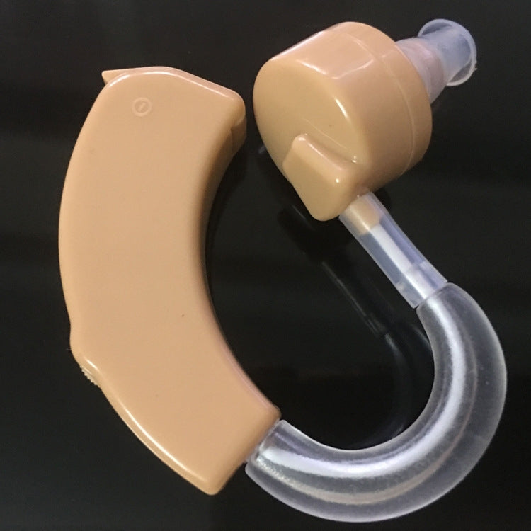 Beige behind-the-ear hearing aid showing earhook and transparent sound tube