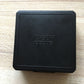 Black hard case with embossed “CYBER SONIC” logo for hearing aid storage