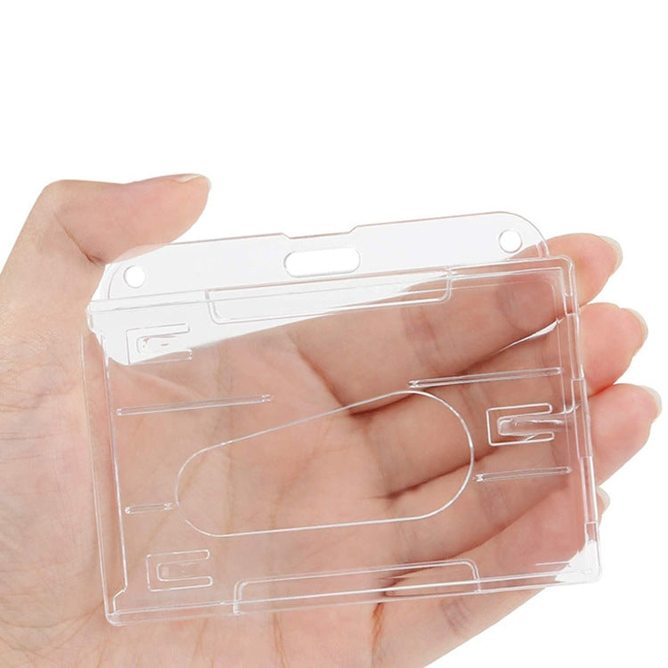 Clear horizontal frosted ID badge holder held in hand, with card window and top grommets.