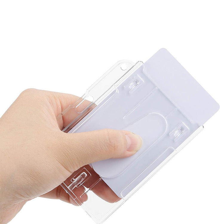 Clear horizontal ID badge holder with frosted cover being inserted by hand.