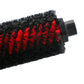 Close-up of robot vacuum main brush roller bristles with black and red pattern