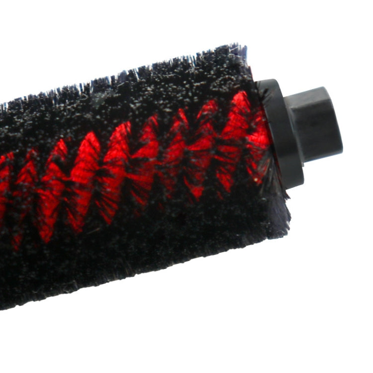 Close-up of robot vacuum main brush roller bristles with black and red pattern