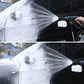 Foam spray pot spraying white foam stream onto vehicle body
