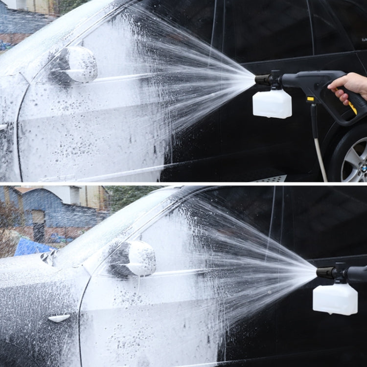 Foam spray pot spraying white foam stream onto vehicle body
